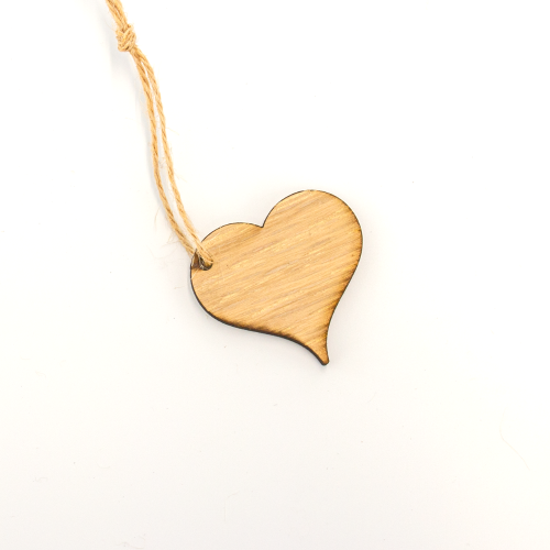 A white background image of a heart shaped wooden gift topper