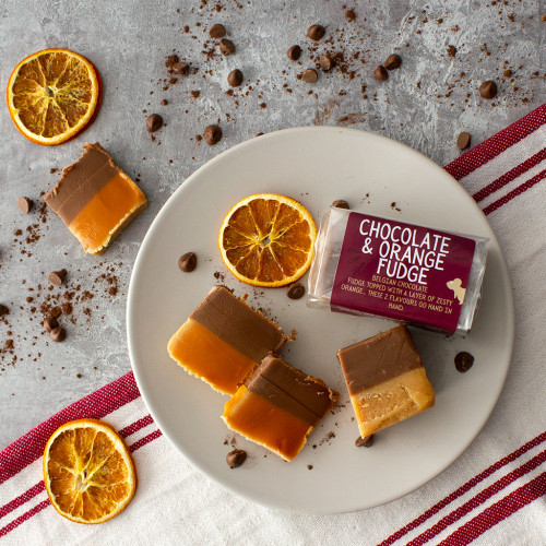 Lifestyle image of a Chocolate Orange Fudge Bar decorated with orange slices