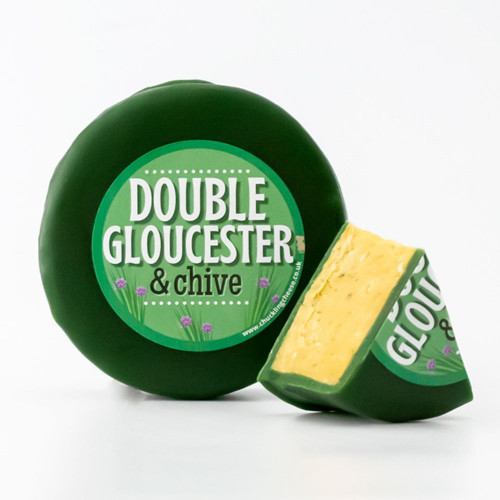 White background image of a truckle of Double Gloucester and Chive with a cut out wedge