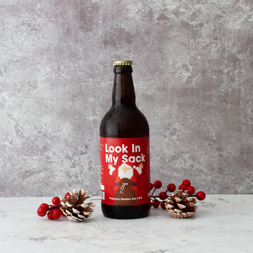 A grey background image of a single bottle of Look in My Sack Comedy Beer