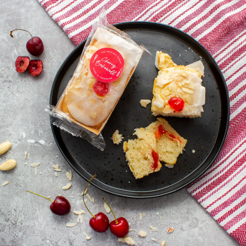 Image of a Cherry Bakewell mini loaf cake availble to purchase from the chuckling cheese company